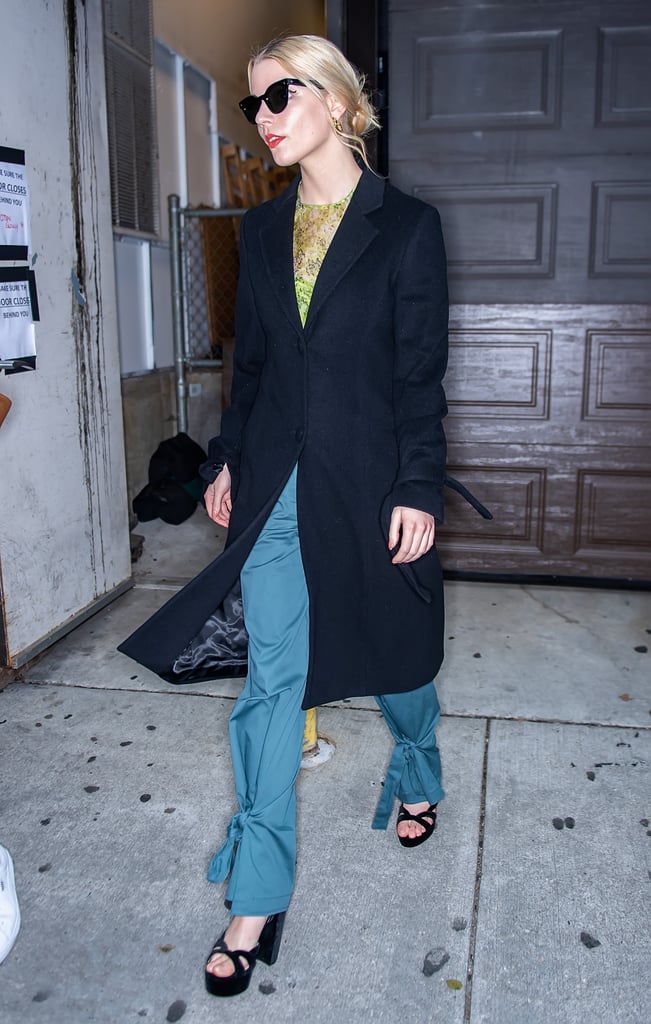 Forever the trendsetter, Anya wore these teal tapered trousers with a green mesh print shirt and sky-high platforms in Philadelphia, PA.