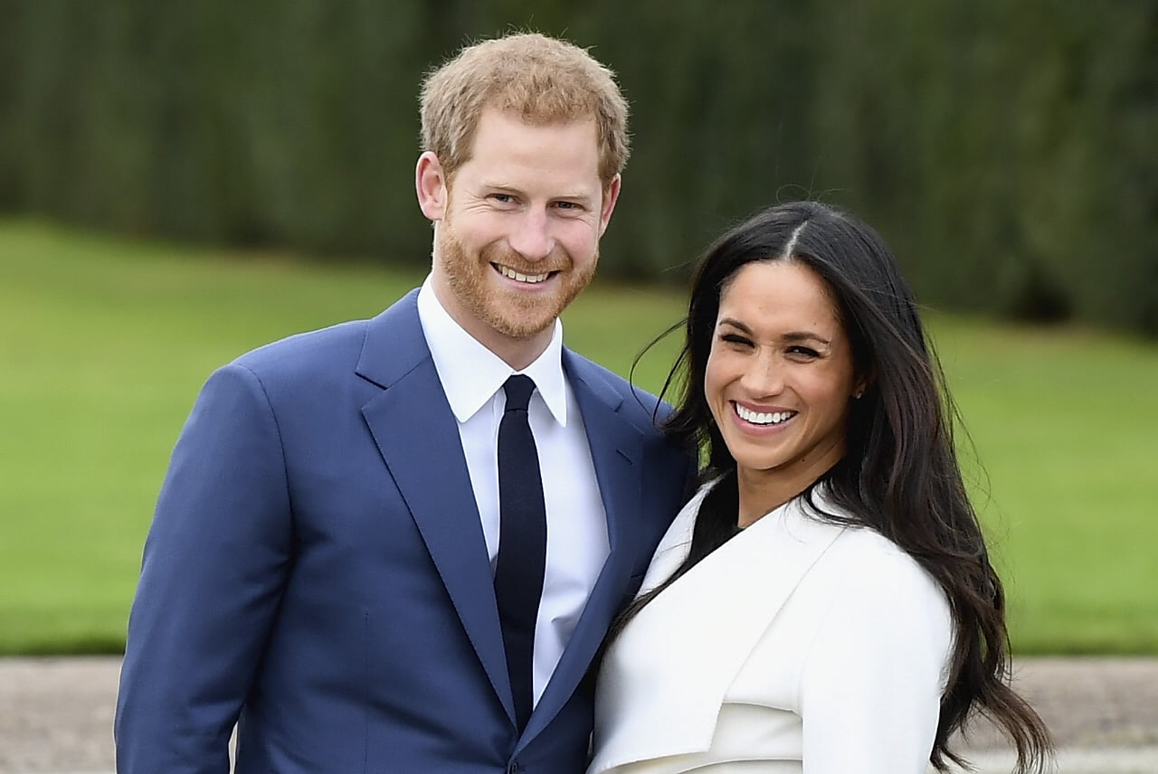 LONDON, ENGLAND - NOVEMBER 27:  Prince Harry (L) and Meghan Markle during an official photocall to announce the engagement of Prince Harry and actress Meghan Markle at The Sunken Gardens at Kensington Palace on November 27, 2017 in London, England.  Prince Harry and Meghan Markle have been a couple officially since November 2016 and are due to marry in Spring 2018.  (Photo by Samir Hussein/Samir Hussein/WireImage)