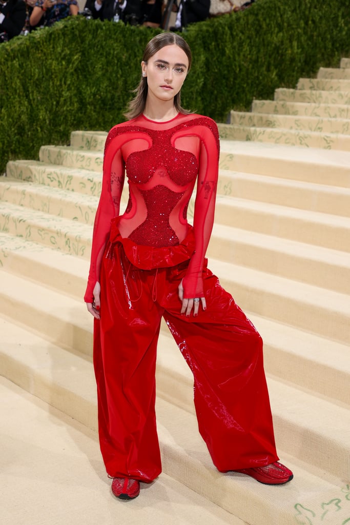 Trust Ella Emhoff to make baggy pants and sneakers look glamorous as ever. For her Met Gala debut, the second daughter and newly minted model wore head-to-toe Adidas by Stella McCartney, walking the red carpet in a diamond mesh bodysuit, oversize trousers, and sneakers all in the same shade of bright red.
Though the cool, comfy vibe was classic Ella, the skintight top with glitter cutouts, which she accessorized with Cartier jewelry and a Stella McCartney purse, was unlike anything we've ever seen her wear. This may be her first-ever Met Gala, but she sure looked like a seasoned pro, even casually posing with Julia Garner at the event. Ahead, see more photos of Ella's fiery red outfit. 

    Related:

            
            
                                    
                            

            Ella Emhoff&apos;s Couture Debut Was One For the Books
