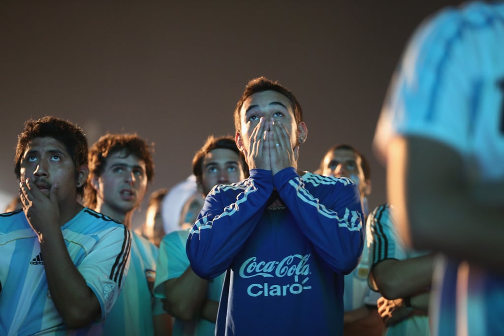 Argentina fans brought their hands to their faces as they watched the final minutes of the game against Bosnia.