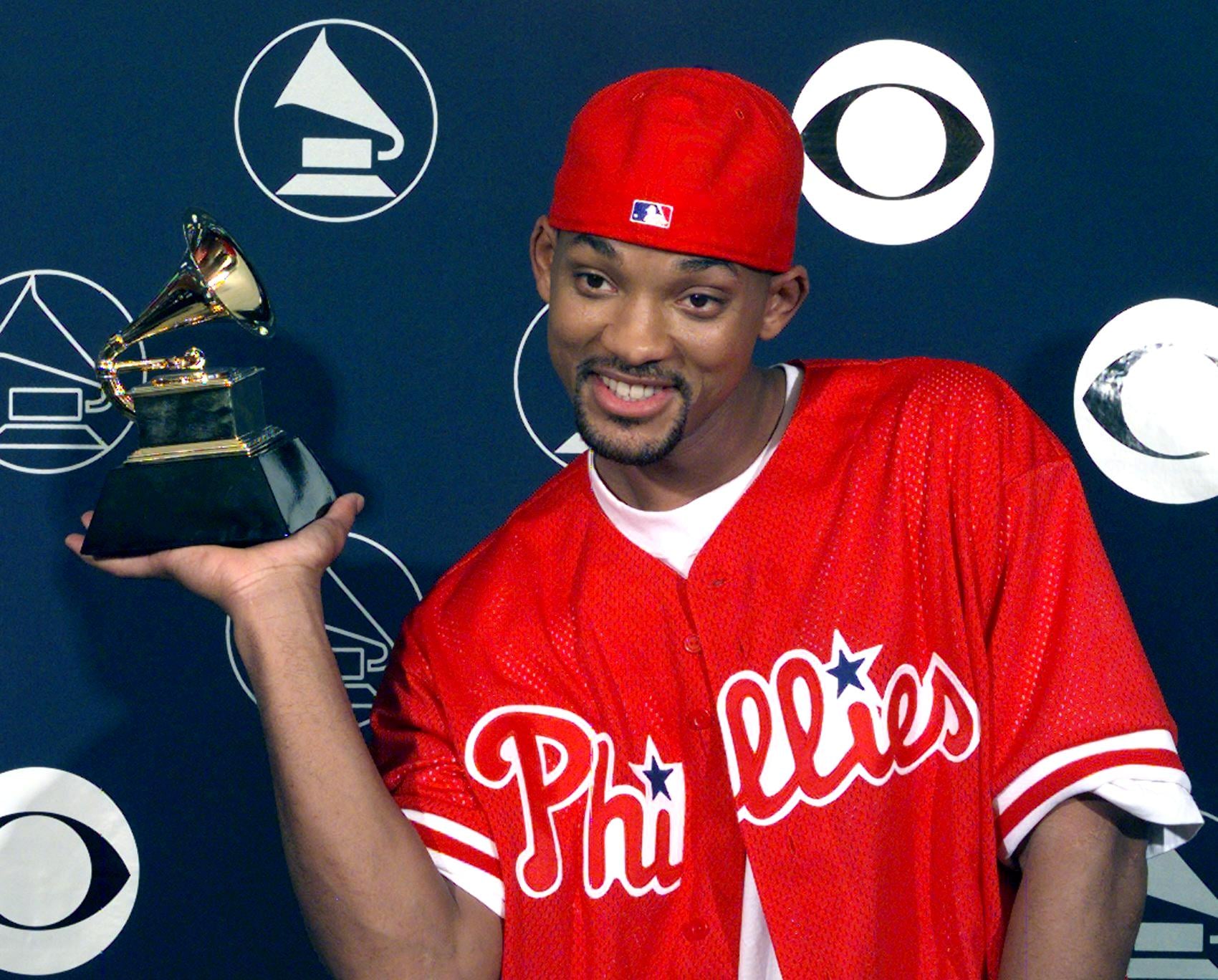 NEW YORK, UNITED STATES: Will Smith holds his Grammy Award 25 February in New York. Smith won best Rap Solo Performance for