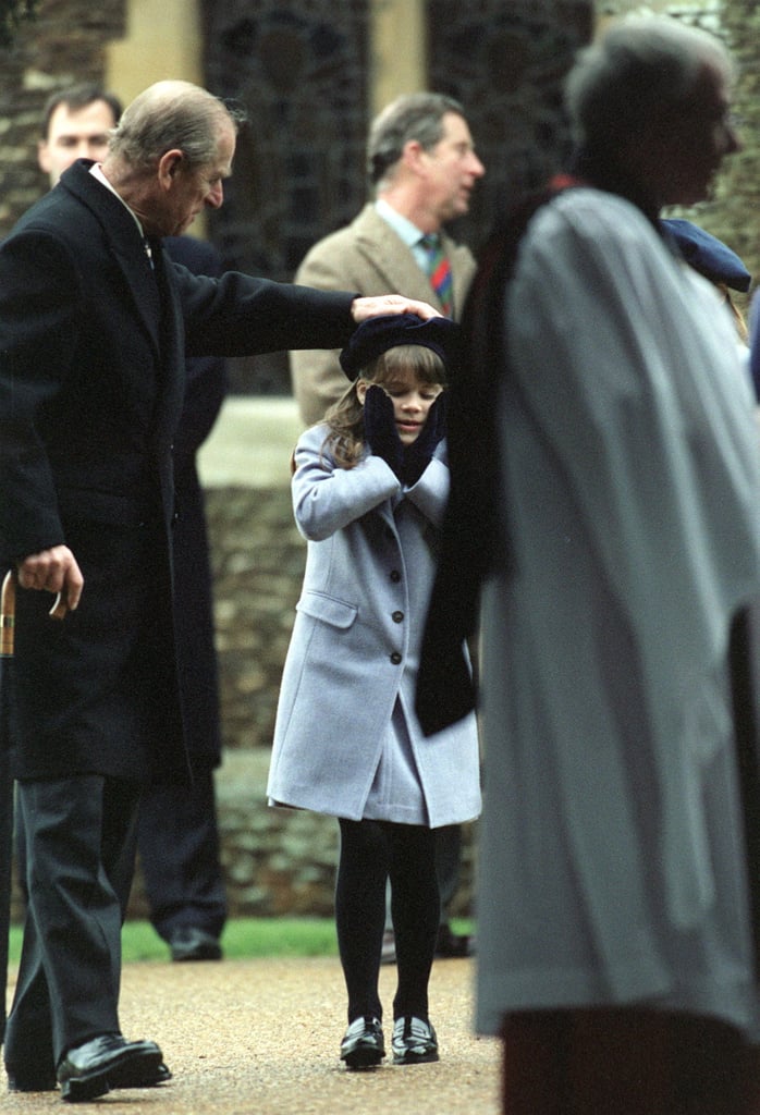 Prince Philip gave his granddaughter Eugenie's hat a playful tap as they left church in 1998.