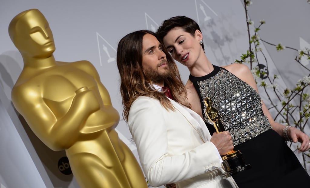 Anne Hathaway got close to Leto in the press room.