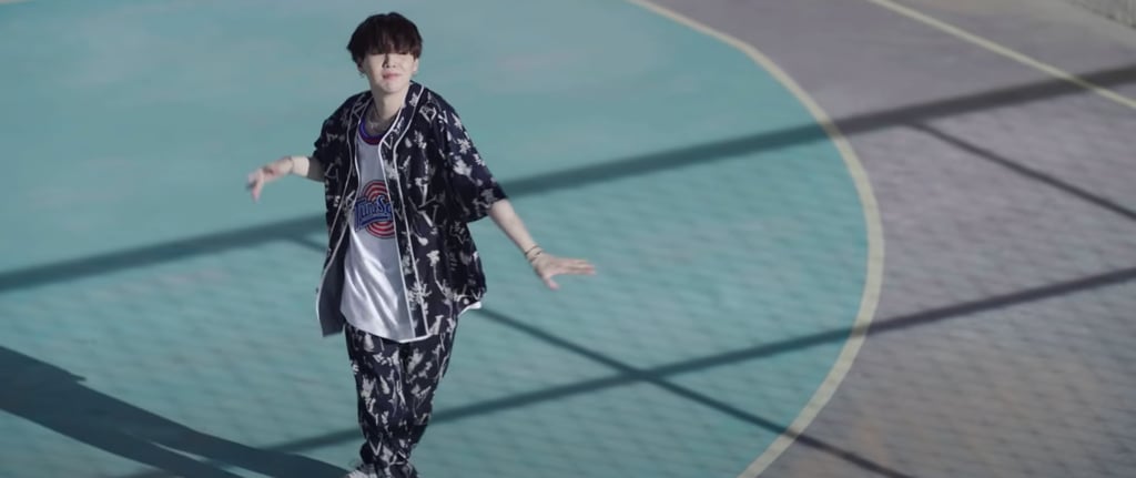 Suga wearing a Tune Squad jersey under a matching Louis Vuitton set is just *chef's kiss*.