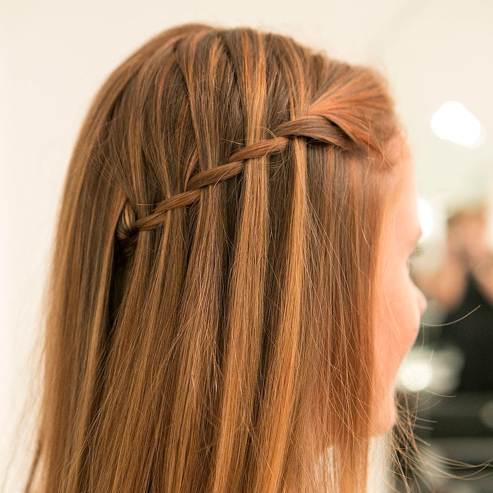 What the heck is a waterfall braid you ask? It's only the chicest way to get a half-up hairstyle. Learn how to re-create this style yourself. 
Source: Caroline Voagen Nelson