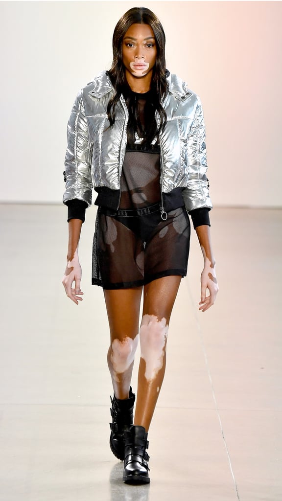 She looked hot, hot, hot in a see through minidress covered by a metallic bomber jacket.