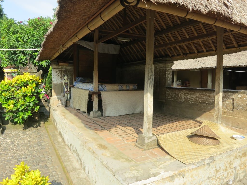 Here is a photo of a traditional Balinese house from our cultural tour. The homes were all open like this, and you'd walk from room to room. Currently, some people still live in homes like this, while others have more modern homes.