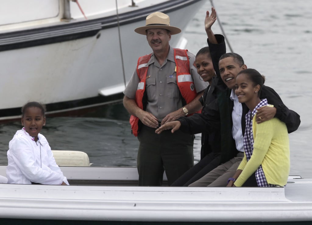 Michelle waved to photographers as the family took a boat tour in Frenchman Bay during their vacation in Bar Harbor, ME, in July 2010.