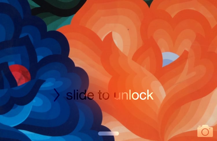 5 seconds after you tap the home button, the "slide to unlock" sign will light up like a GIF.