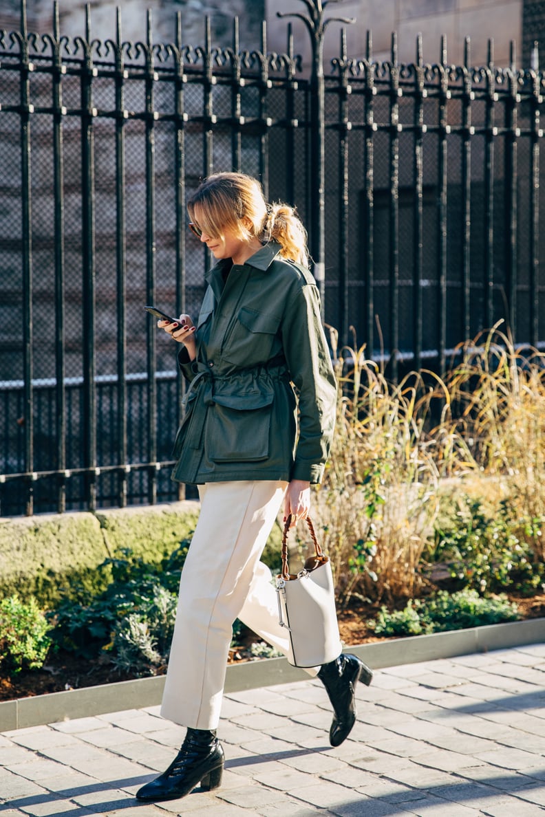 Wear Black Boots With Neutral Cropped Trousers and a Short Military Trench