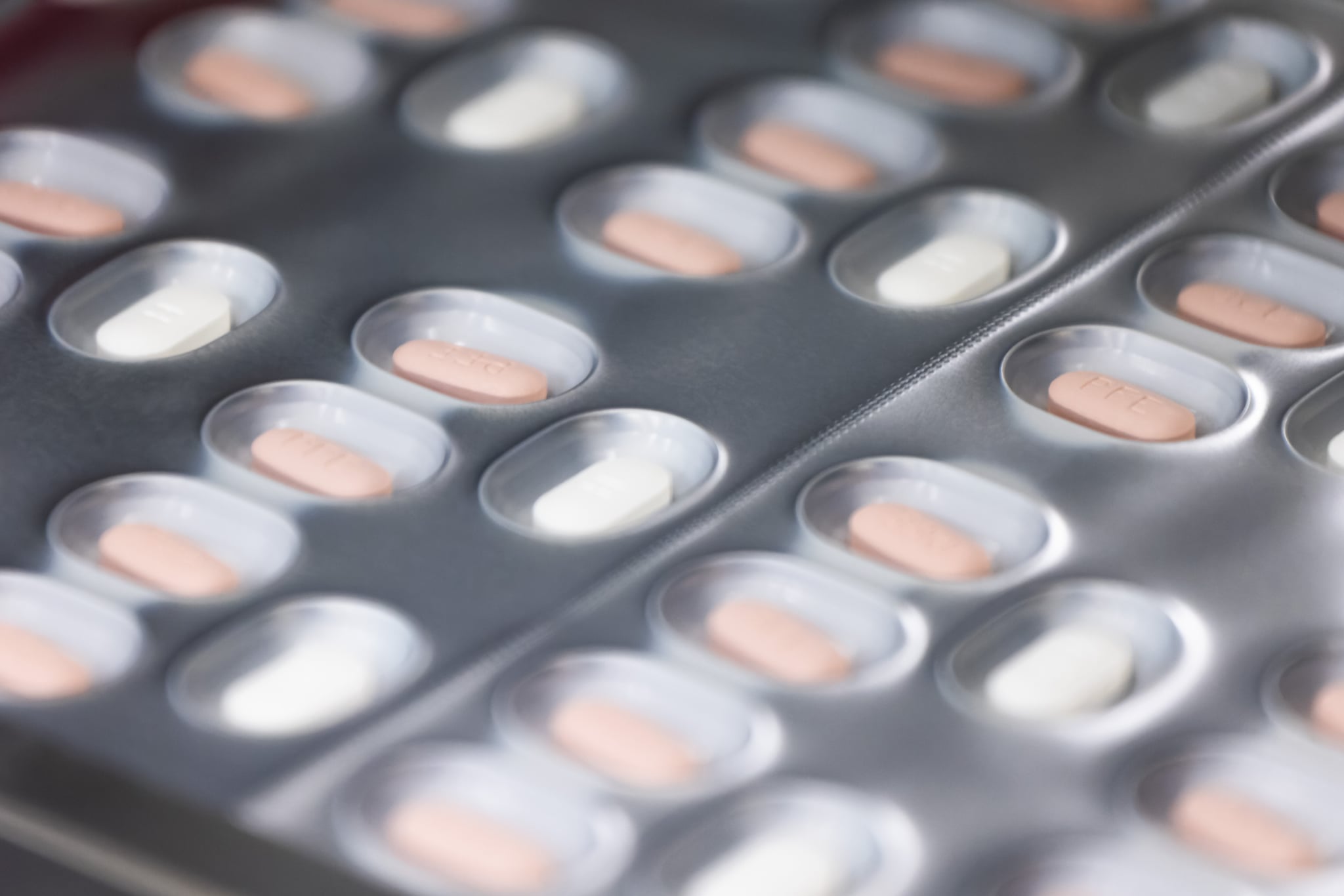 24 May 2022, Baden-Wuerttemberg, Freiburg im Breisgau: Tablets of the drug Paxlovid for the treatment of Covid-19 pass through a packaging line in a building owned by Pfizer. The facility is designed to enable an automated production process of drugs, including antiviral tablets against Covid-19. Photo: Philipp von Ditfurth/dpa (Photo by Philipp von Ditfurth/picture alliance via Getty Images)