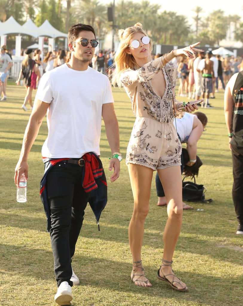 Devon Windsor wearing an embroidered romper, Sunday Somewhere sunglasses, and sandals at the festival.
Devon Windsor wearing an embroidered romper, Sunday Somewhere sunglasses, and sandals at the festival.