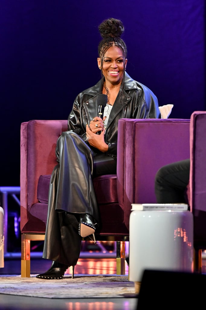 While speaking on stage in Atlanta, she wore a flared leather jacket and matching trousers from Palmer Harding, with a Reiss tank layered underneath.