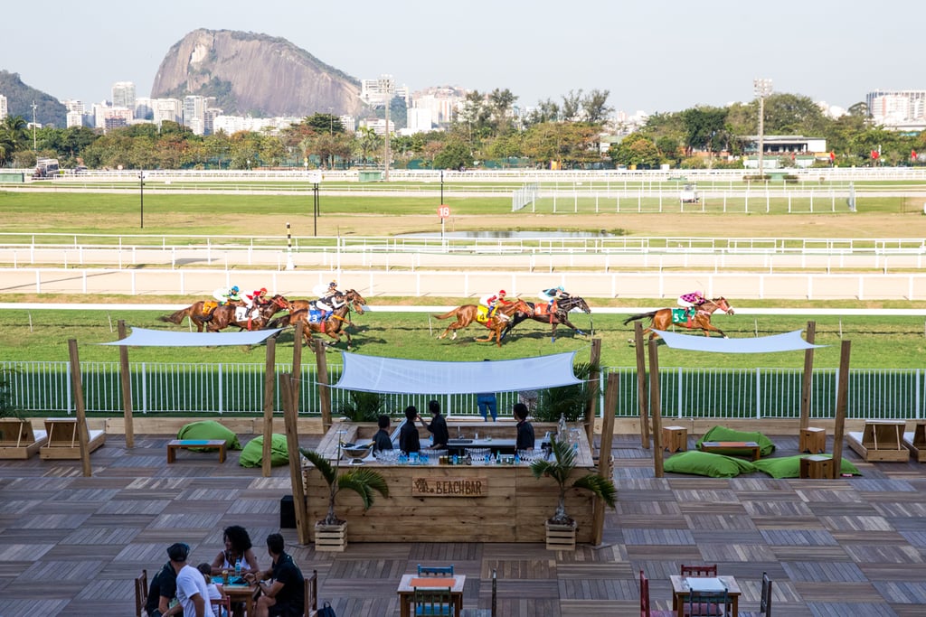 The heart of the Safe House is the backyard area, which just so happens to run alongside the racetrack of the Jockey Club Brasileiro and has incredible views of the Corcovado mountain and the Christ the Redeemer statue. With two open bars and plenty of cabanas, bean bags, and tables to chill at, it's one of the most beautiful settings to take in a race. If the horse races get boring, there's also a cornhole field to pass the time at.