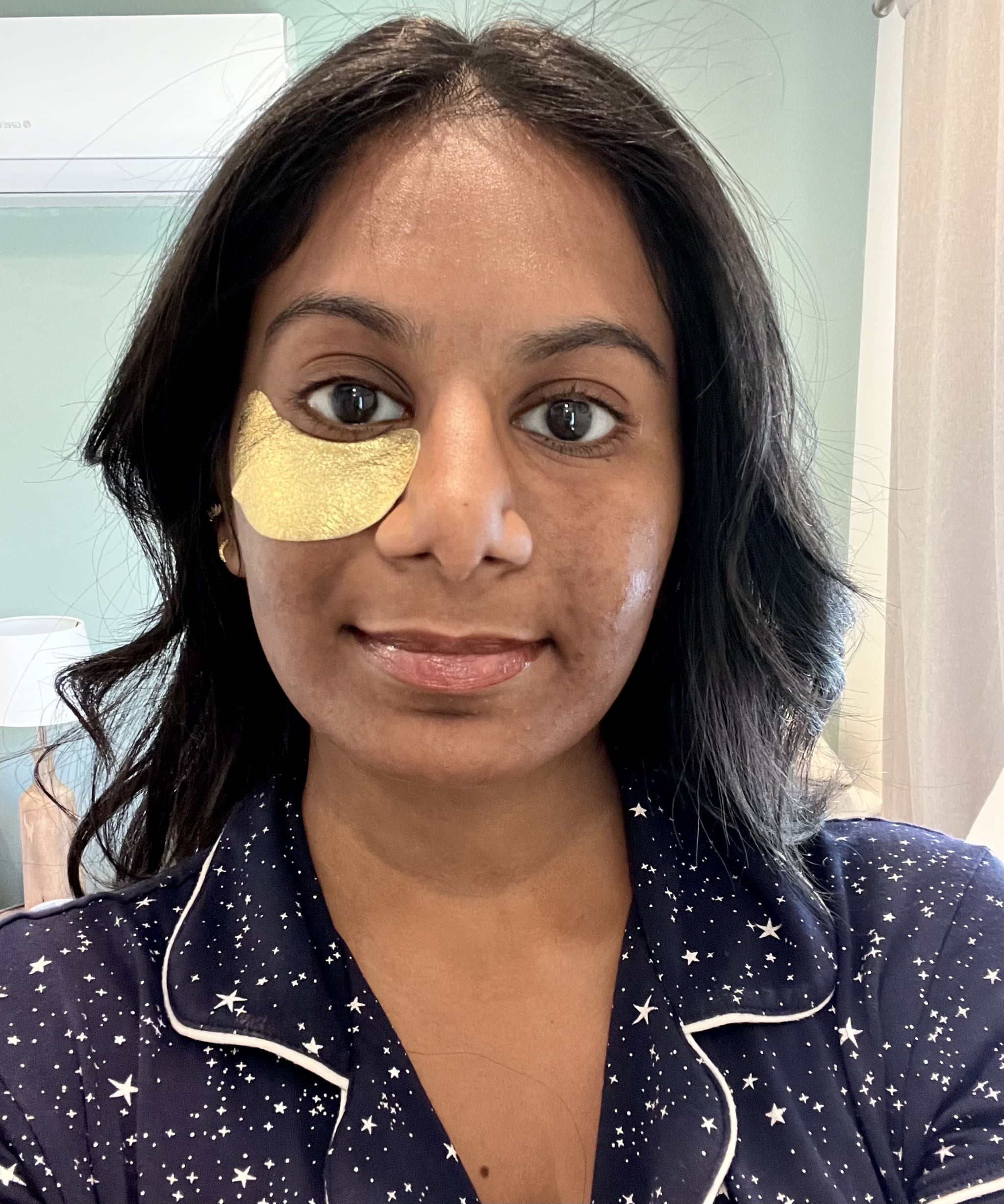 Before and after using the Wander Beauty Baggage Claim Eye Masks. Right side of the woman's face depicts how the eye masks worked to de-puff and awaken the under-eye area. The left side still has the eye patch on.