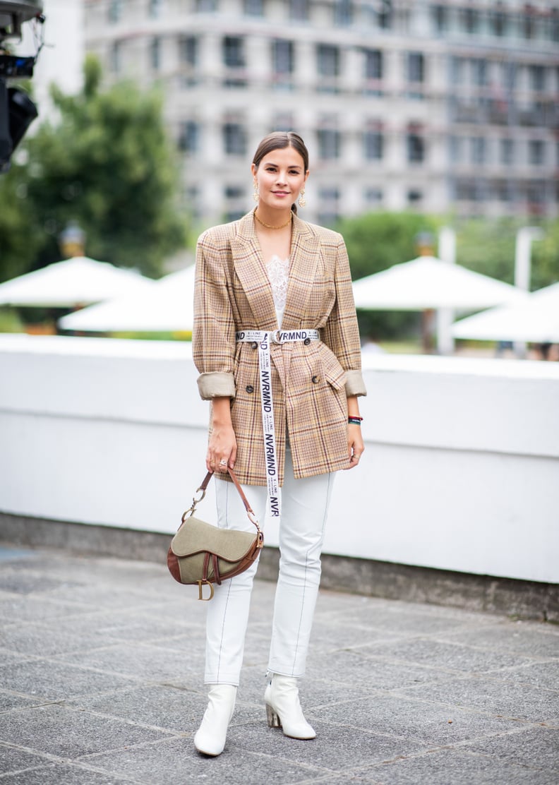 Belt a plaid blazer over white denim to take your light jeans into Fall and Winter.