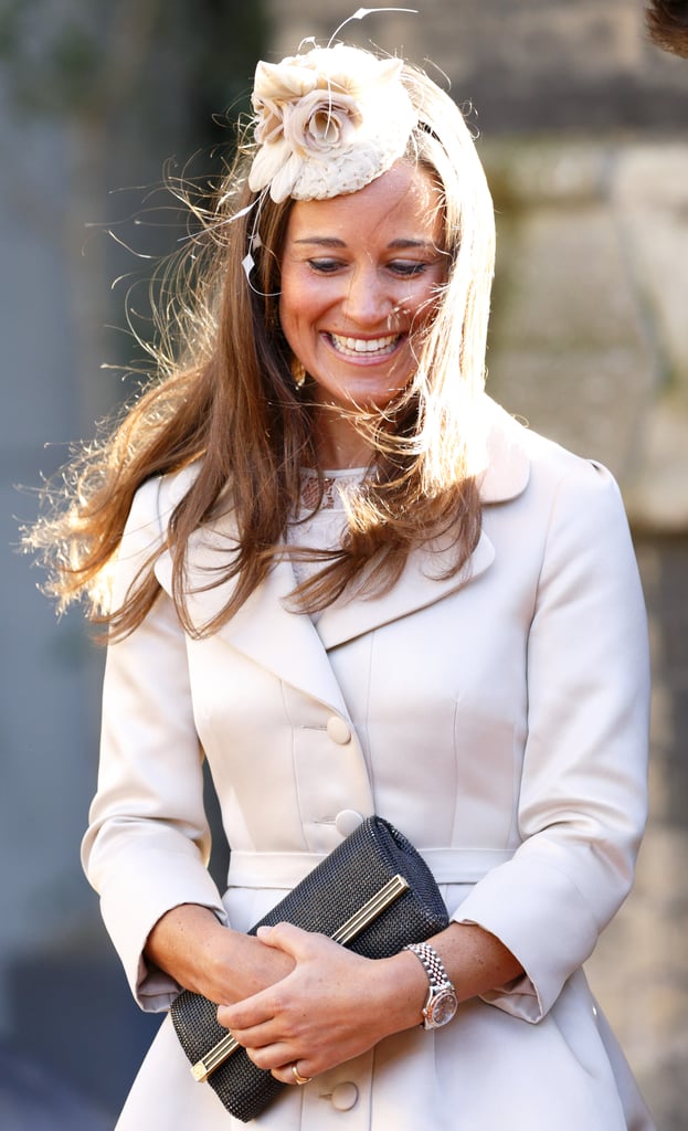 For a wedding in Feb. 2014, Pippa added a little flair to a coatdress with a floral headpiece.