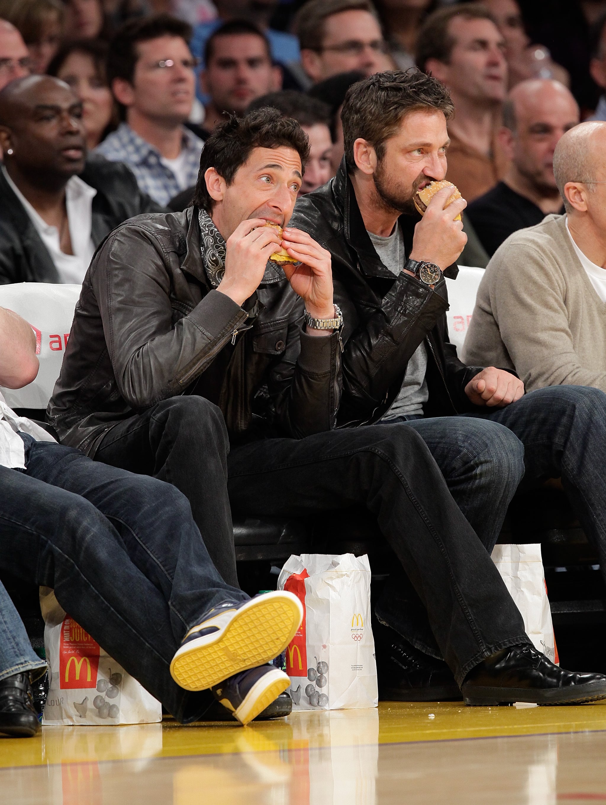 Adrien Brody and Gerard Butler chowed down on burgers while watching