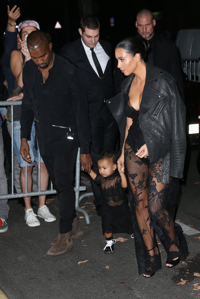 Kim Kardashian, Kanye West, and North West at the Givenchy Show in 2014