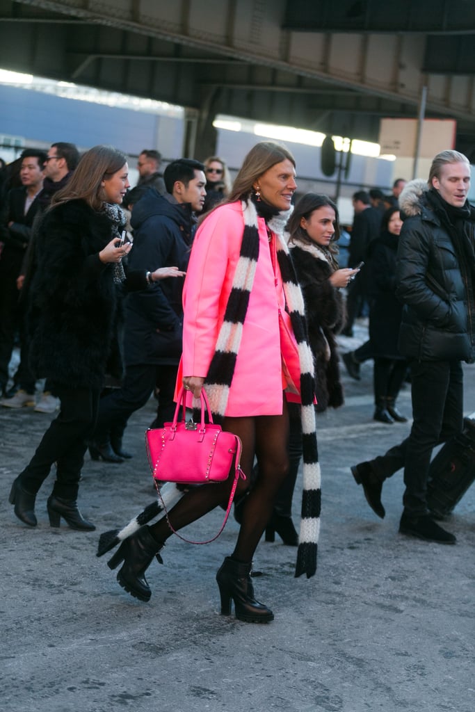 Just look at Anna Dello Russo's bubblegum-pink coat, and try not to smile. 
Source: Melodie Jeng/The NYC Streets