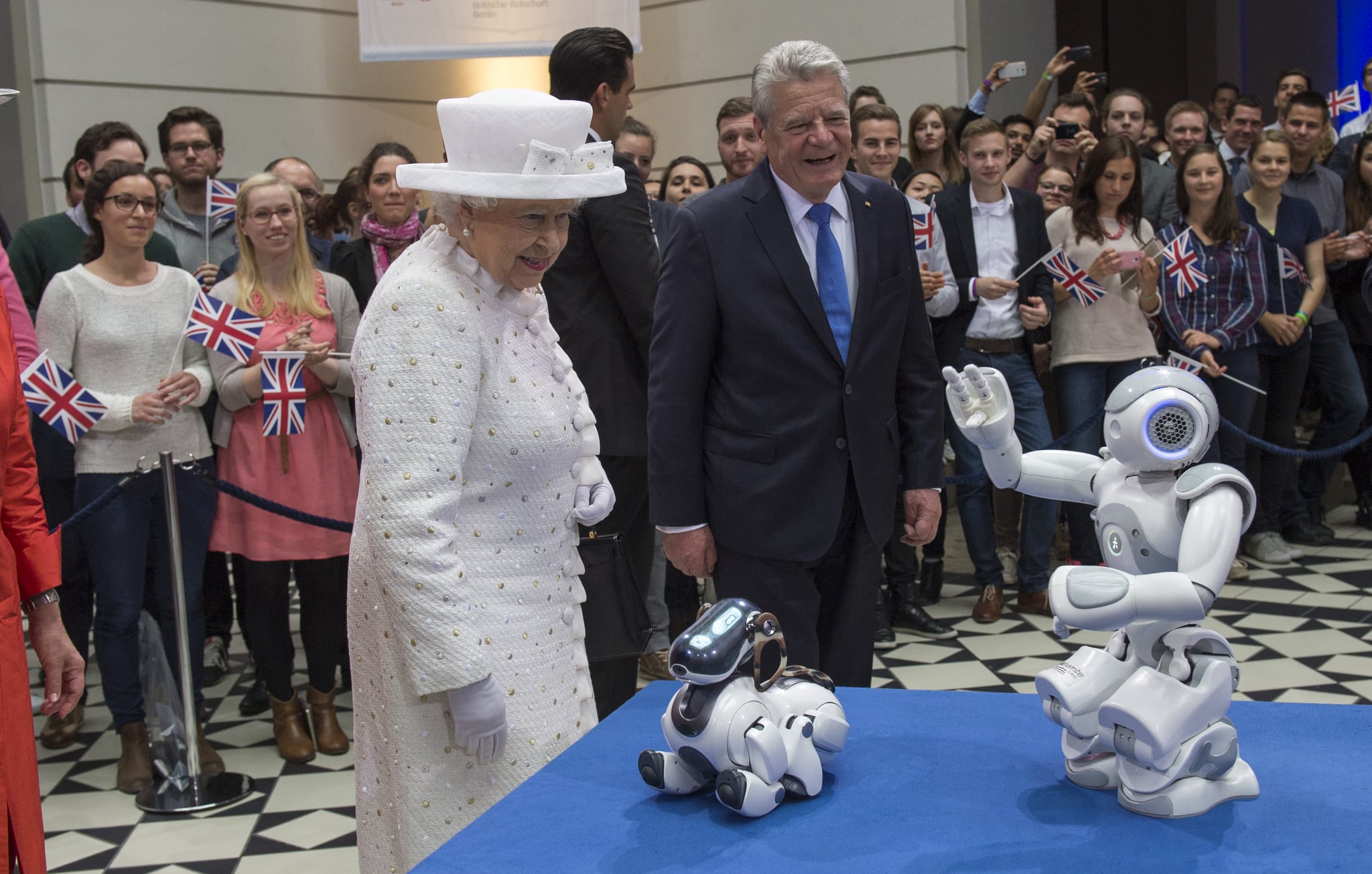 Queen Elizabeth II and German President Joachim Gauck watch robots at Berlin's University of Technology in 2015