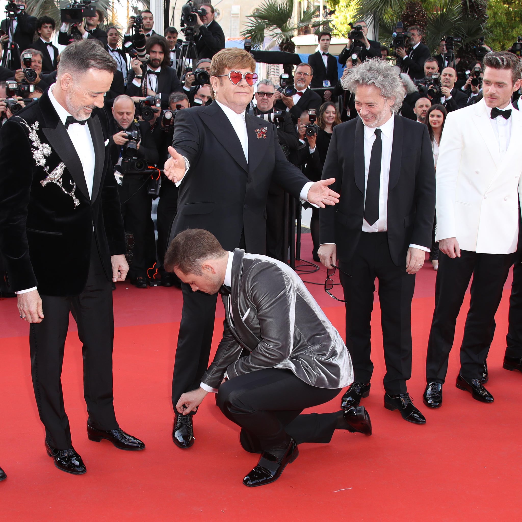 Taron Egerton Tying Elton John's Shoe Cannes Film Festival | POPSUGAR  Celebrity