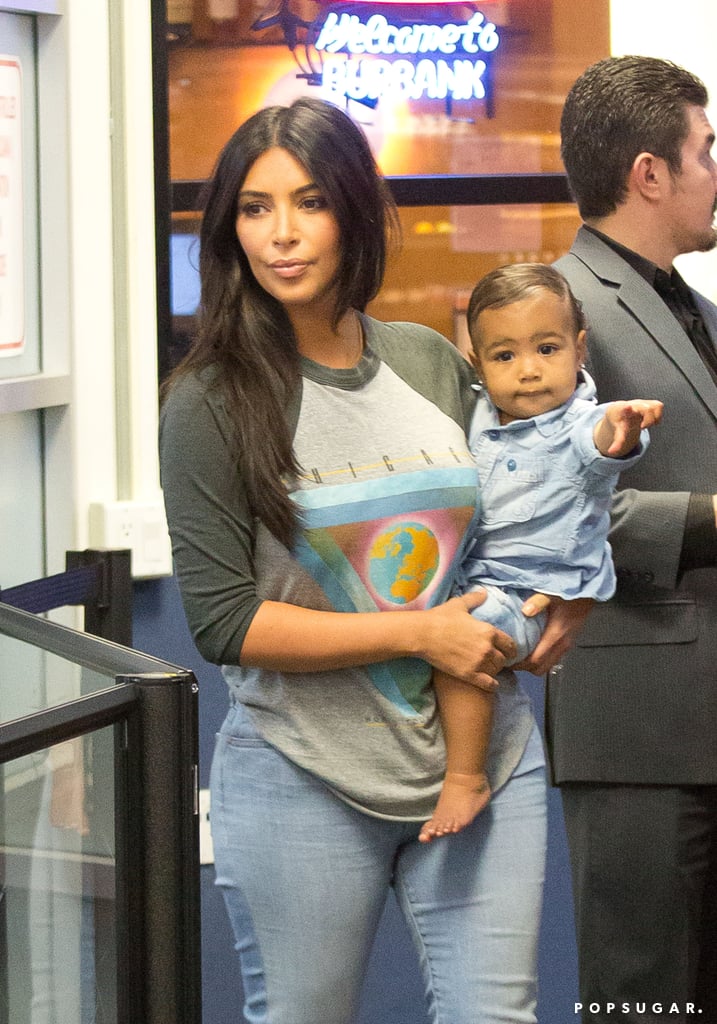 Kim Kardashian Carrying North West in LAX | Photos