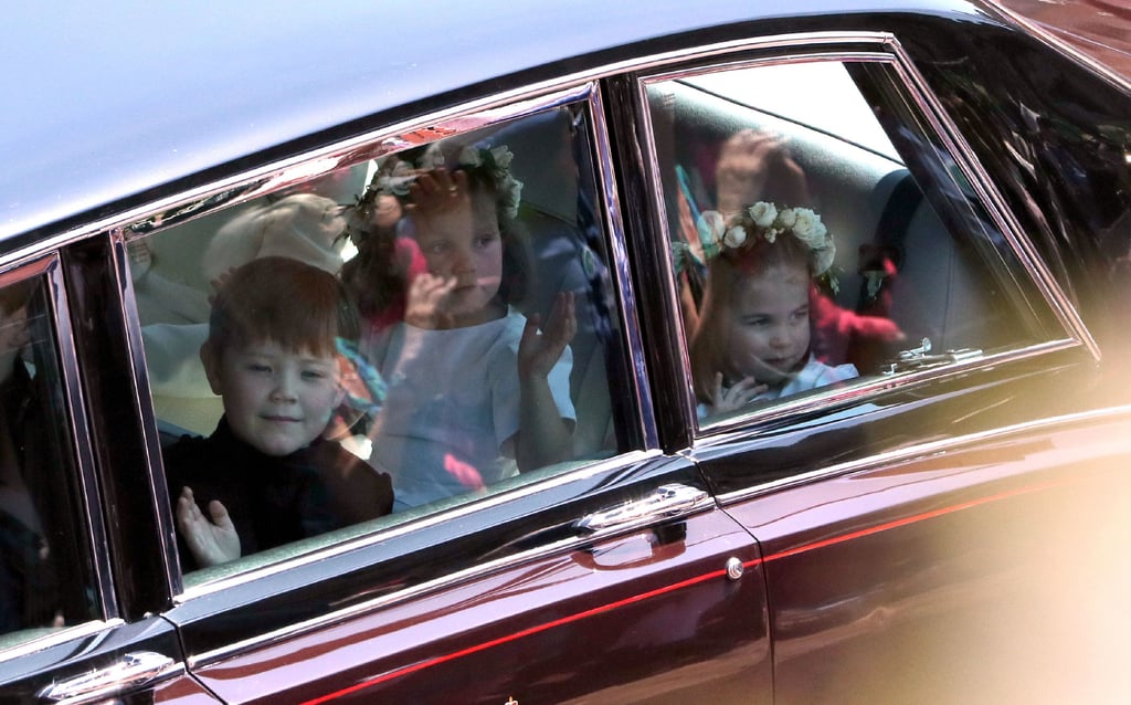 The pageboys and bridesmaids waved from their car.