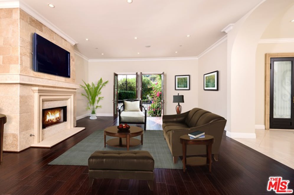 Everywhere you go there is a fireplace, and this spot, near the front door, is perfect for welcoming guests.