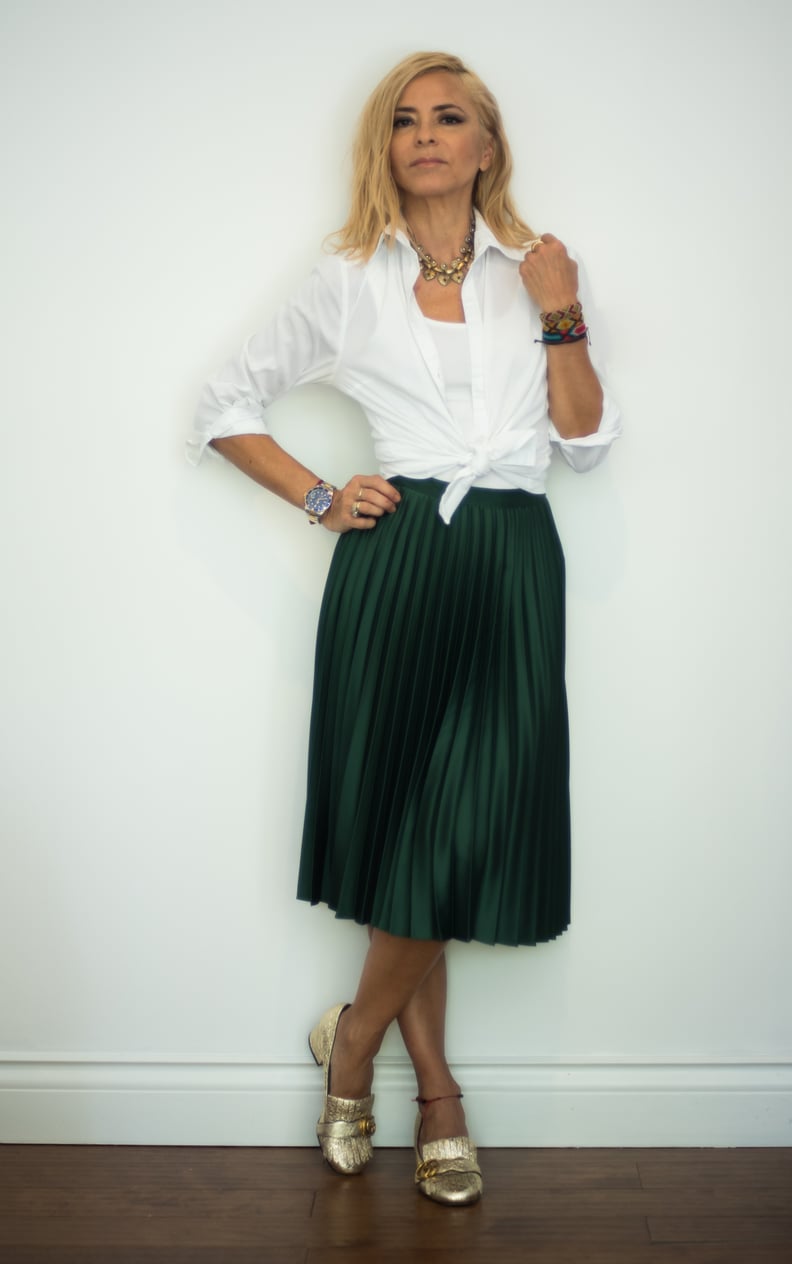 With a Pleated Green Midi Skirt, a White Shirt, and Gold Flats