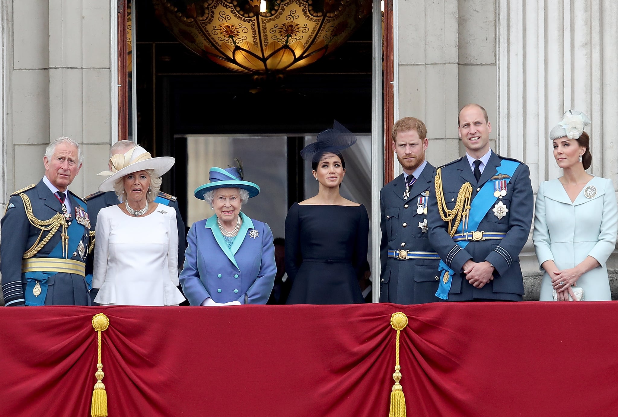 LONDON, ENGLAND - JULY 10:  (L-R)  Prince Charles, Prince of Wales, Camilla, Duchess of Cornwall, Queen Elizabeth II, Meghan, Duchess of Sussex, Prince Harry, Duke of Sussex, Prince William, Duke of Cambridge and Catherine, Duchess of Cambridge watch the RAF flypast on the balcony of Buckingham Palace, as members of the Royal Family attend events to mark the centenary of the RAF on July 10, 2018 in London, England.  (Photo by Chris Jackson/Chris Jackson/Getty Images)
