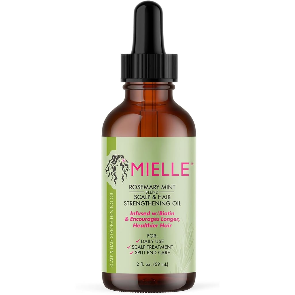 Mielle Organics Rosemary Mint Scalp & Hair Strengthening Oil ($11)
"Today, edges are a part of the popular lexicon in a playful way (i.e. "snatched my edges"), but my whole life they've been a pretty sensitive topic. Because Black women are more prone to traction alopecia, the reality is we can lose our edges — the short hair found in our hairline area — due to styles that pull tightly like braids or extensions. 
To combat that, I give my hair a break in between tension-causing styles, and use this Mielle Organics Rosemary Mint Scalp and Hair Strengthening Oil. The TikTok-viral, best-selling product has rosemary to improve scalp health, mint to invigorate your scalp, and biotin which nourishes your hair follicles. My edges are slowly coming back in full force so I'm not ashamed to tell everyone about it!" — Jessica Andrews, senior style director