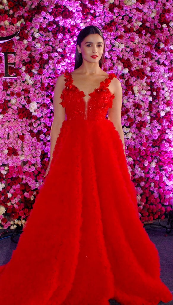 Looking ravishing in a flowy red gown.