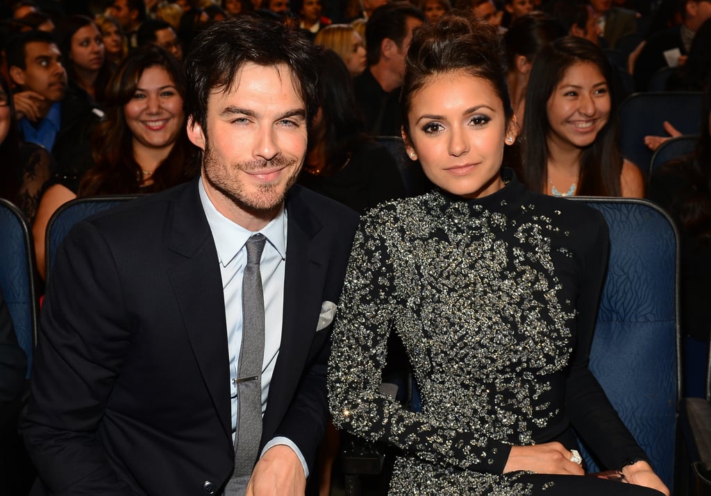 Ian and Nina sat together in the crowd.