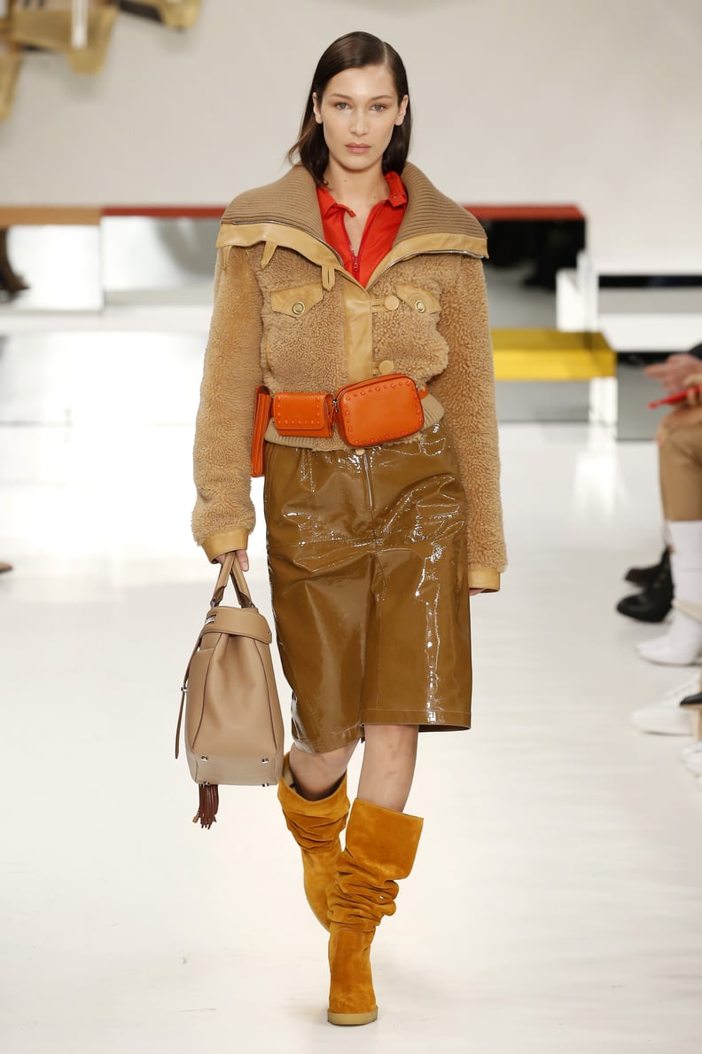 Bella Modeled a Shearling Coat and Orange Waist Bag at Tod's