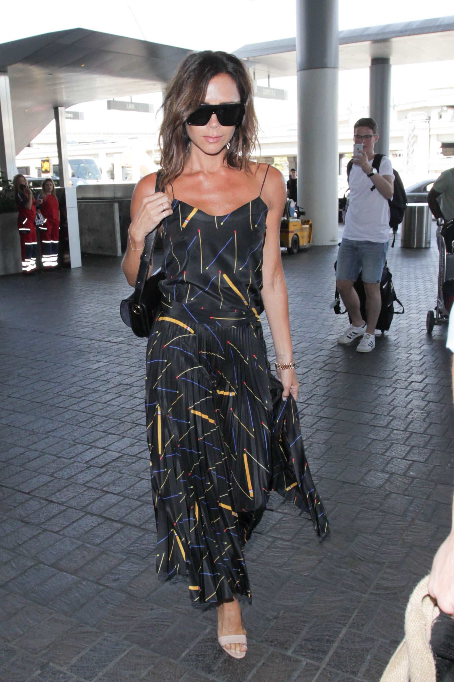 Victoria Beckham's Airport Outfits | POPSUGAR Fashion