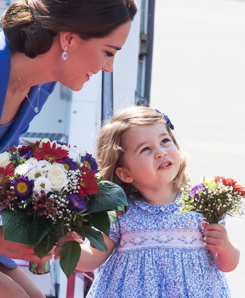 Even with gorgeous flowers in her hands, Kate was peering over at her little girl (and as usual, something out of the shot had Charlotte's undivided attention).

    Related:

            
            
                                    
                            

            The Adorable Thing the Duke and Duchess of Cambridge Always Do When They Talk to George and Charlotte