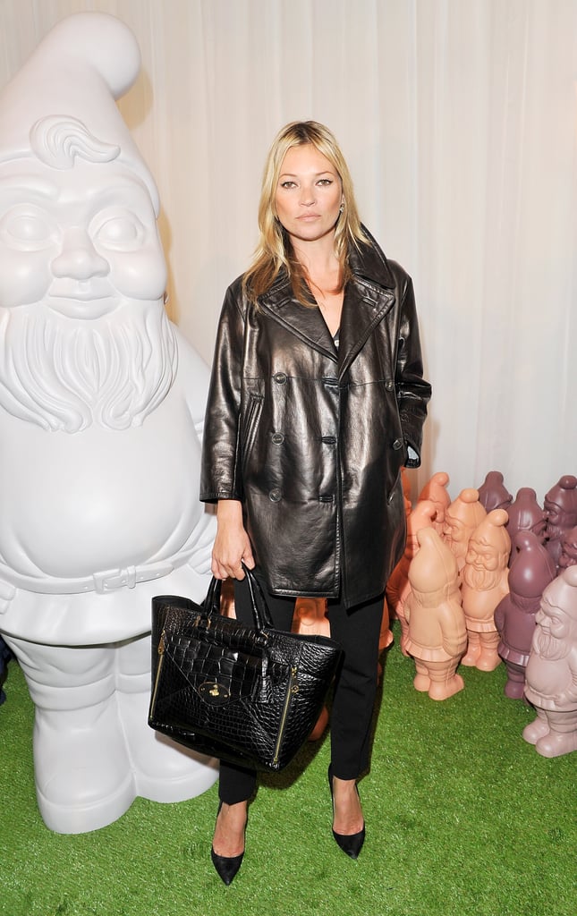 Kate Moss wore a Mulberry look for its London Fashion Week show in September 2012. The ensemble comprised a peacoat, silk blouse, ankle-length trousers, and the highly coveted Willow tote.