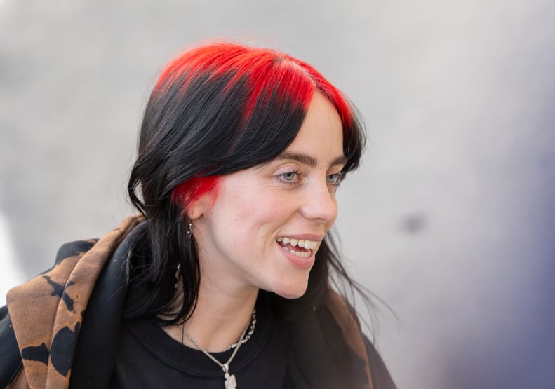 Billie Eilish highlights her sideburns in red