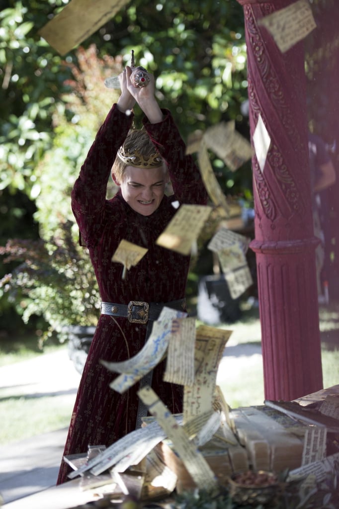 Joffrey rudely chops up Tyrion's wedding gift.