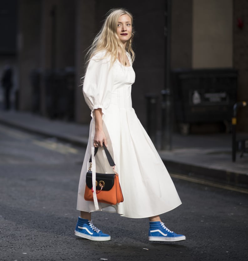 With a Simple, Poufy-Sleeved Dress and Handbag