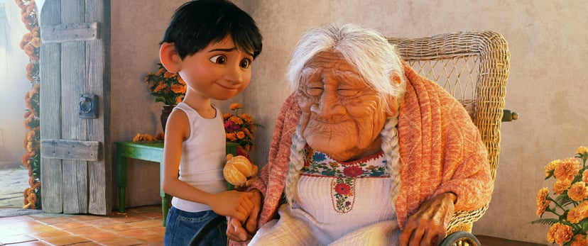 COCO, from left: Miguel (voice: Anthony Gonzalez), Mama Coco (voice: Ana Ofelia Murguia), 2017.  Walt Disney Studios Motion Pictures /Courtesy Everett Collection