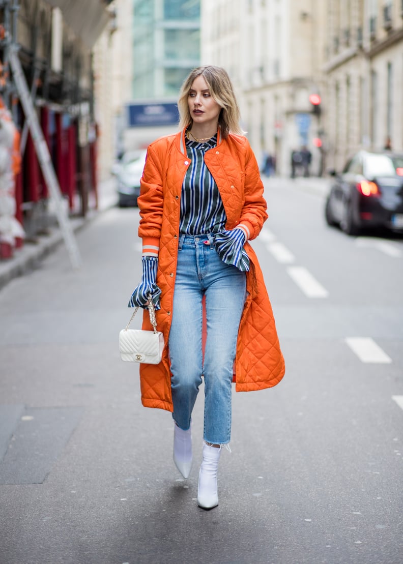 Pair White Boots With a Bright Orange Coat and Mom Jeans