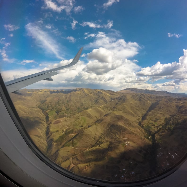 Relish the beauty of the Andes Mountains from your plane side window.