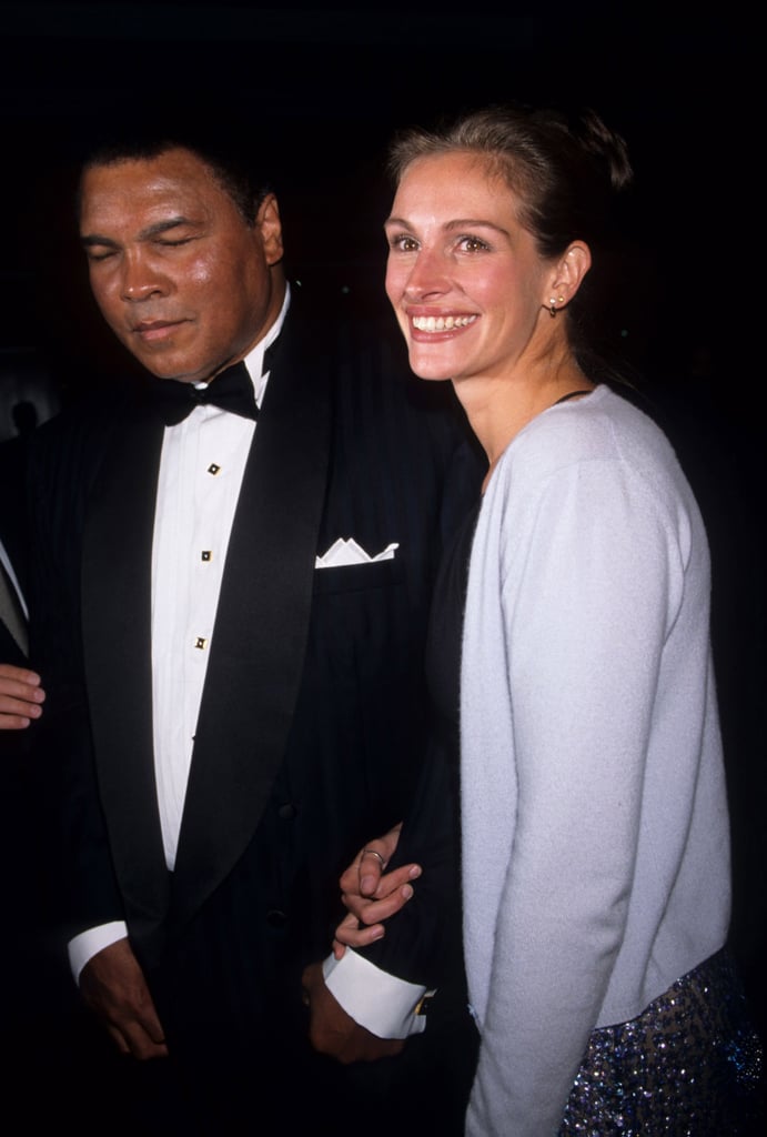 Julia smiled with Muhammad Ali at an Amnesty International party in 1998.