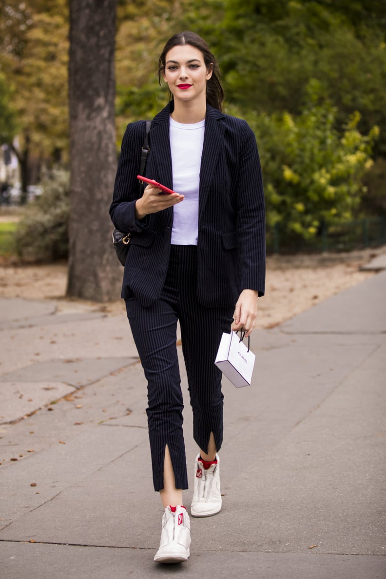 Vittoria Ceretti Wore a Pantsuit With Sneakers While Leaving the Chanel Show
