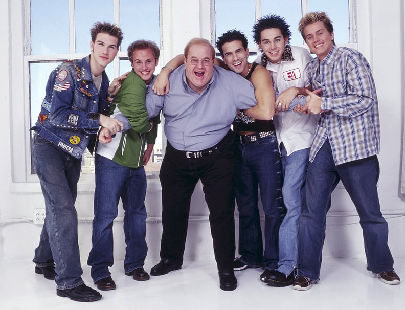 NEW YORK - CIRCA 2001: Lou Pearlman poses with boy band O-Town, Jacob Underwood, Ashley Parker Angel, Erik Estrada, Trevor Penick and Dan Miller seen in New York, circa 2001. (Photo by Mark Weiss/WireImage)