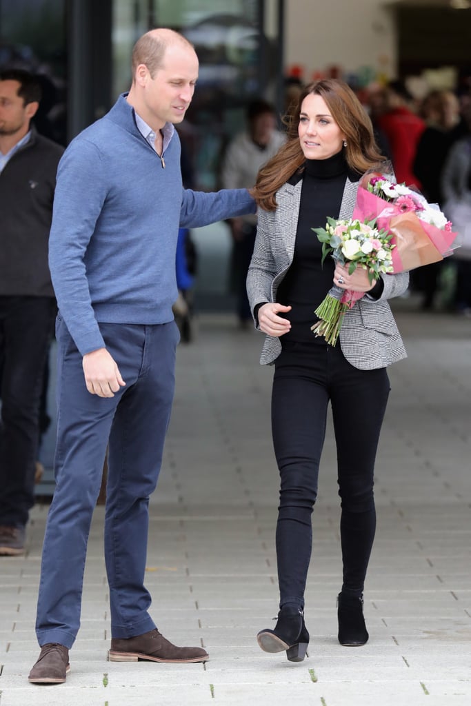 Will led Kate as she held on to flowers from fans after a visit to Basildon Sporting Village in October 2018.