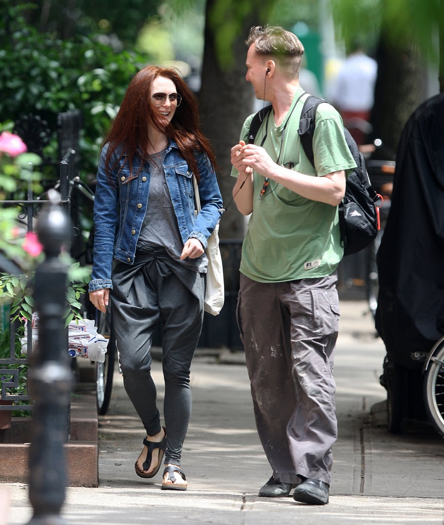 Julianne Moore took her denim jacket on an avant-garde ride by pairing it with gray trousers featuring a dramatic pleated waist.