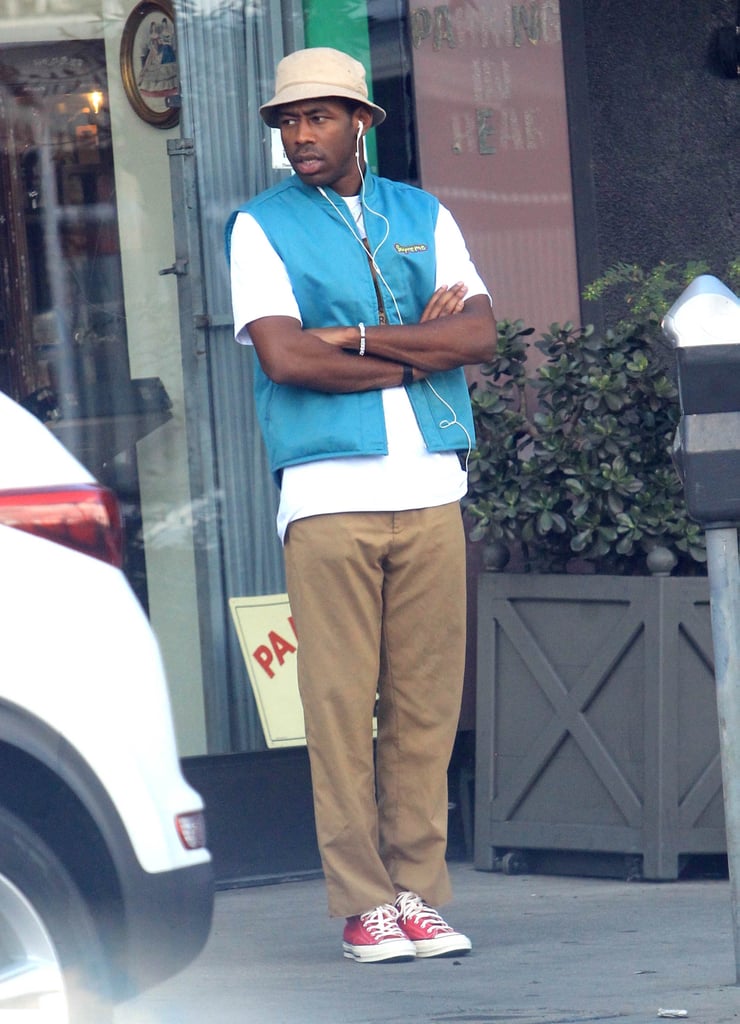 While in L.A., Tyler took dad style to a new level in a blue vest, bucket hat, and khaki pants.